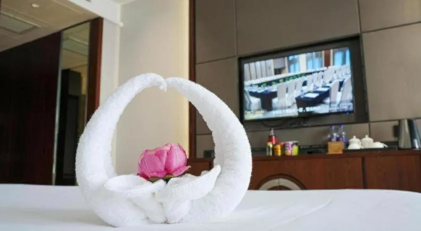 Bed in Jiyuan Oriental Jianguo Hotel