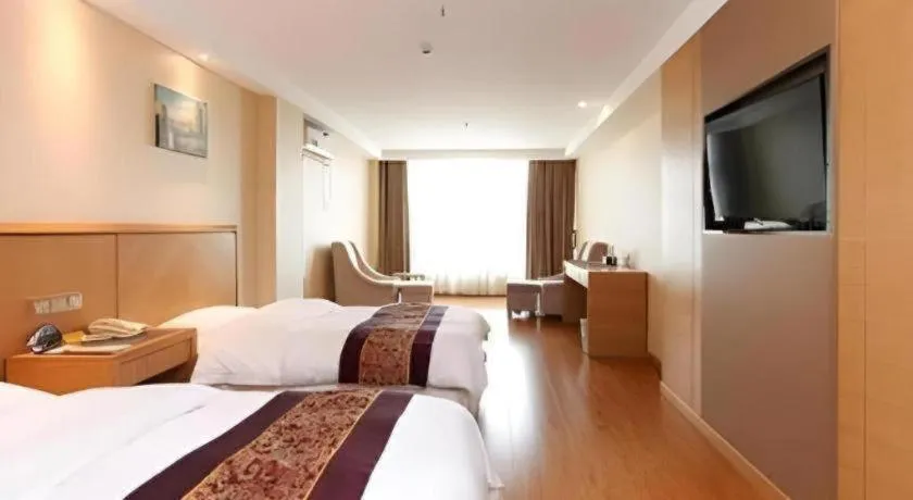 Bed in GreenTree Inn Jiangsu Wuxi Huishan High-Speed Rail Qianzhou Chongwen Road Business Hotel