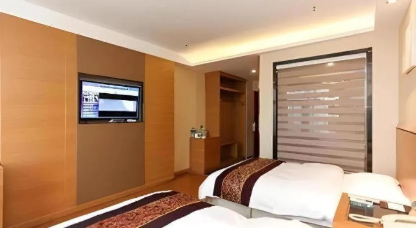 Bed in GreenTree Inn Jiangsu Wuxi Huishan High-Speed Rail Qianzhou Chongwen Road Business Hotel