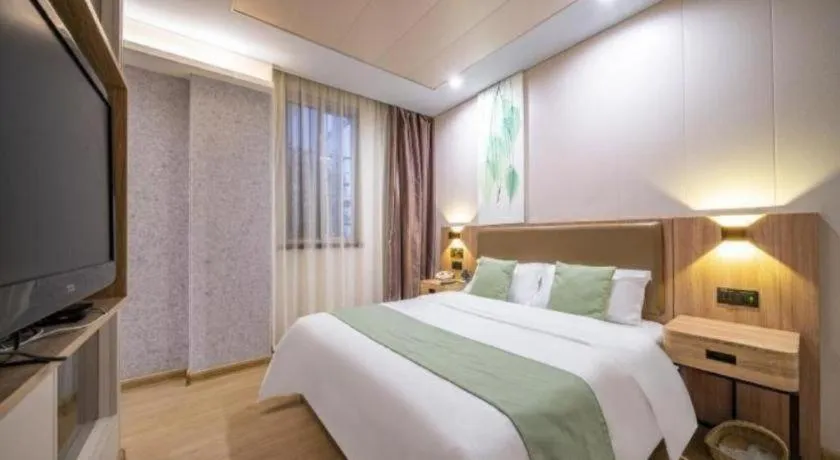 Bed in GreenTree Inn Jining Yanzhou Jiuzhou Fangyuan Business Hotel