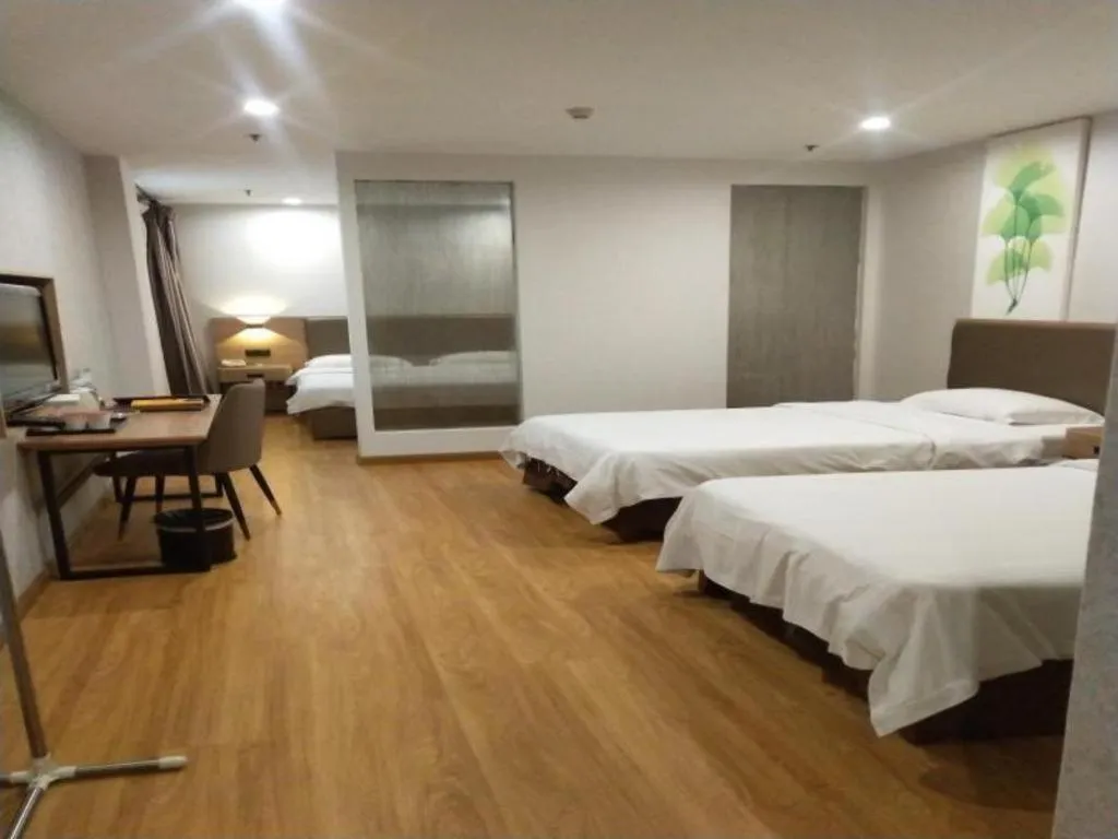 Bed in GreenTree Inn Jining Yanzhou Jiuzhou Fangyuan Business Hotel