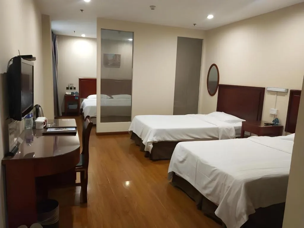 Bed in GreenTree Inn Jining Yanzhou Jiuzhou Fangyuan Business Hotel