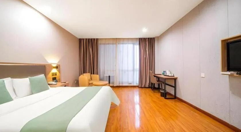 Bed in GreenTree Inn Jining Yanzhou Jiuzhou Fangyuan Business Hotel