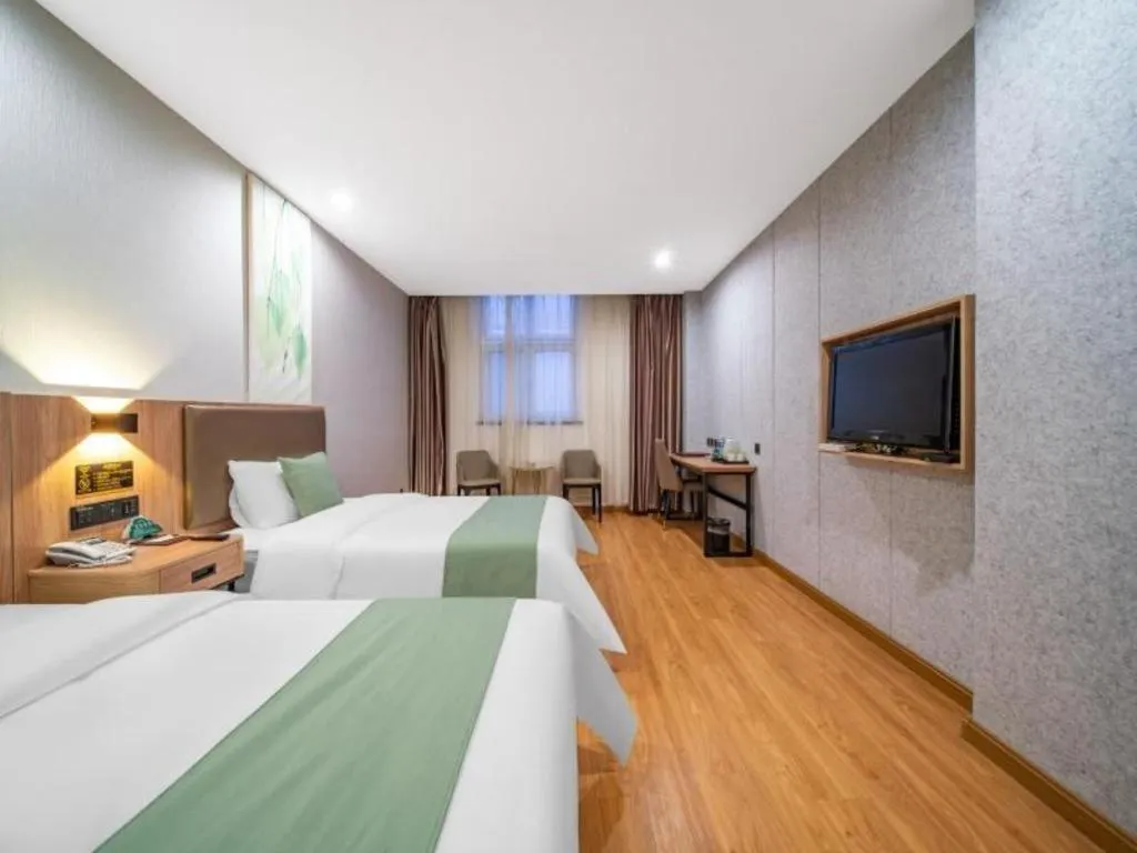 Bed in GreenTree Inn Jining Yanzhou Jiuzhou Fangyuan Business Hotel