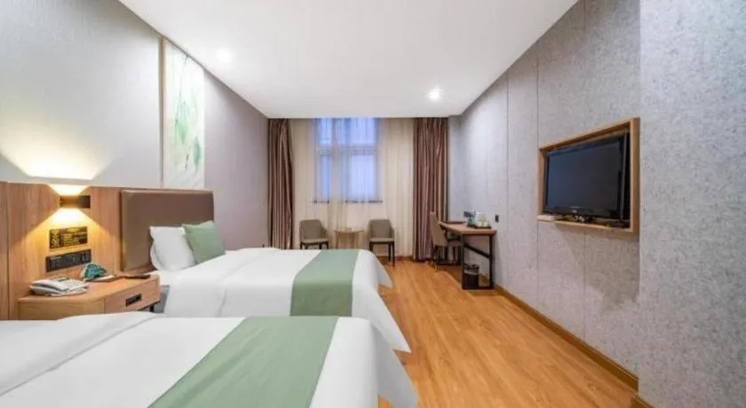 Bed in GreenTree Inn Jining Yanzhou Jiuzhou Fangyuan Business Hotel