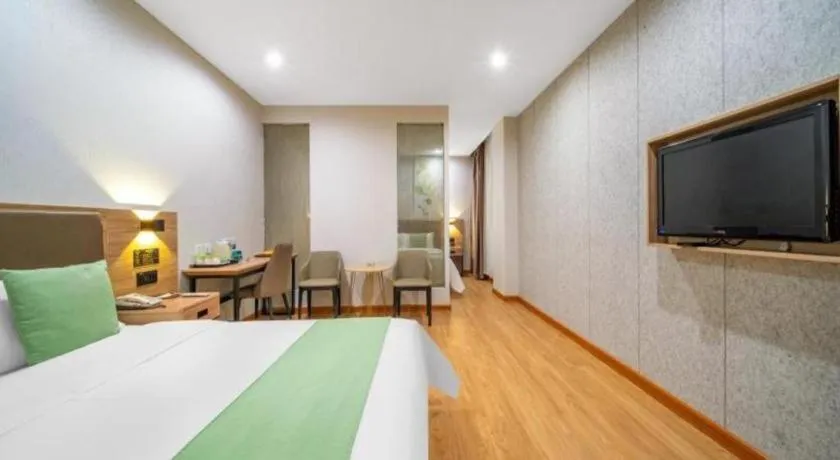 Bed in GreenTree Inn Jining Yanzhou Jiuzhou Fangyuan Business Hotel