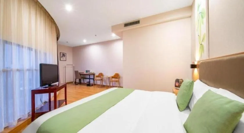 Bed in GreenTree Inn Jining Yanzhou Jiuzhou Fangyuan Business Hotel