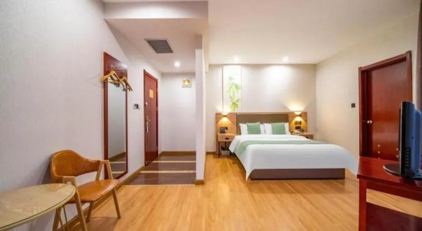 Bed in GreenTree Inn Jining Yanzhou Jiuzhou Fangyuan Business Hotel