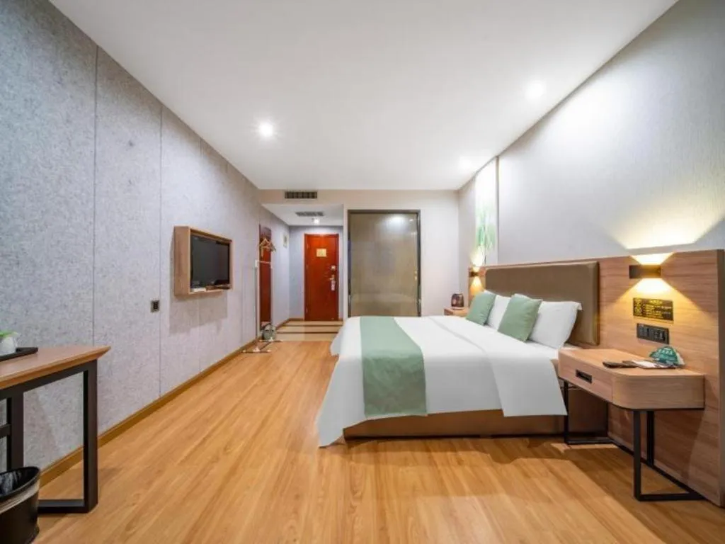 Bed in GreenTree Inn Jining Yanzhou Jiuzhou Fangyuan Business Hotel