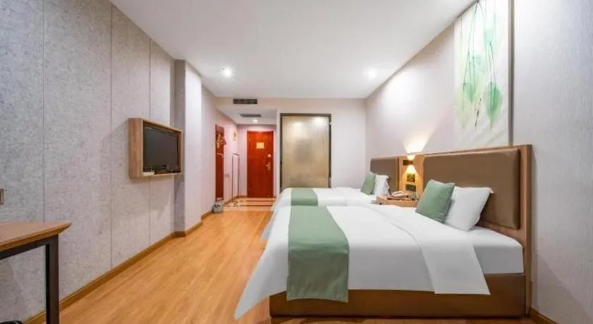 Bed in GreenTree Inn Jining Yanzhou Jiuzhou Fangyuan Business Hotel