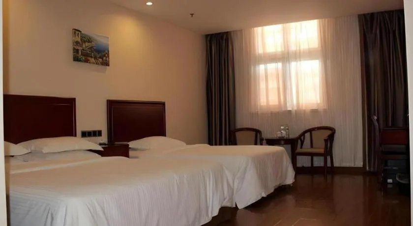 Bed in GreenTree Inn Jining Yanzhou Jiuzhou Fangyuan Business Hotel