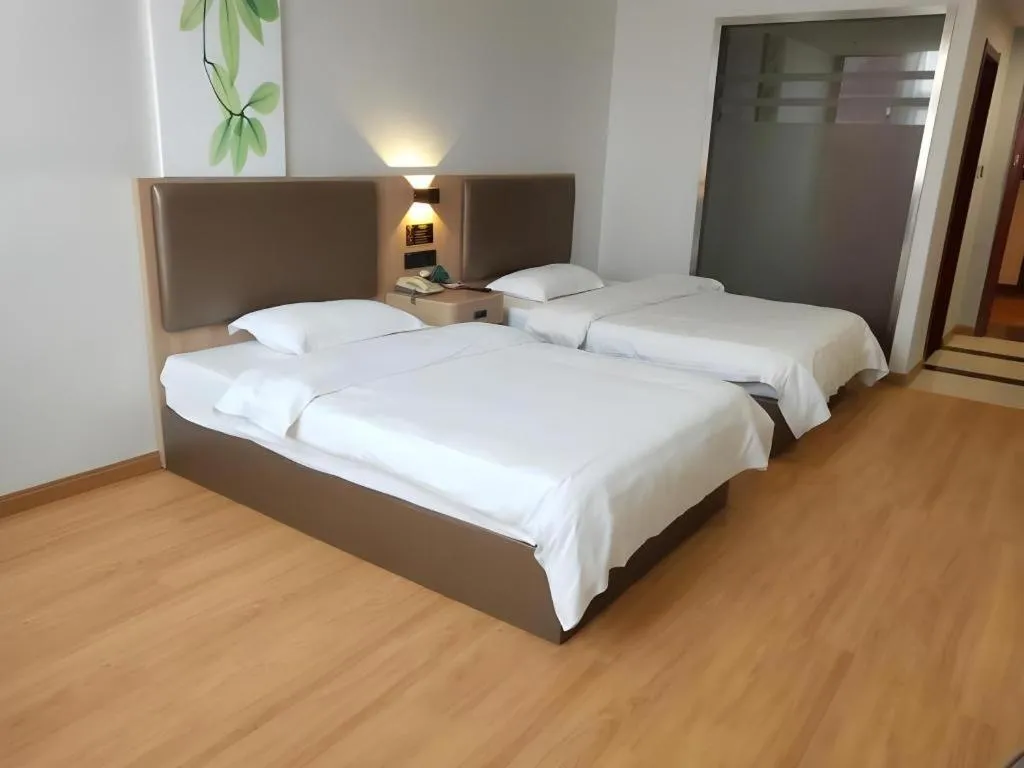 Bed in GreenTree Inn Jining Yanzhou Jiuzhou Fangyuan Business Hotel