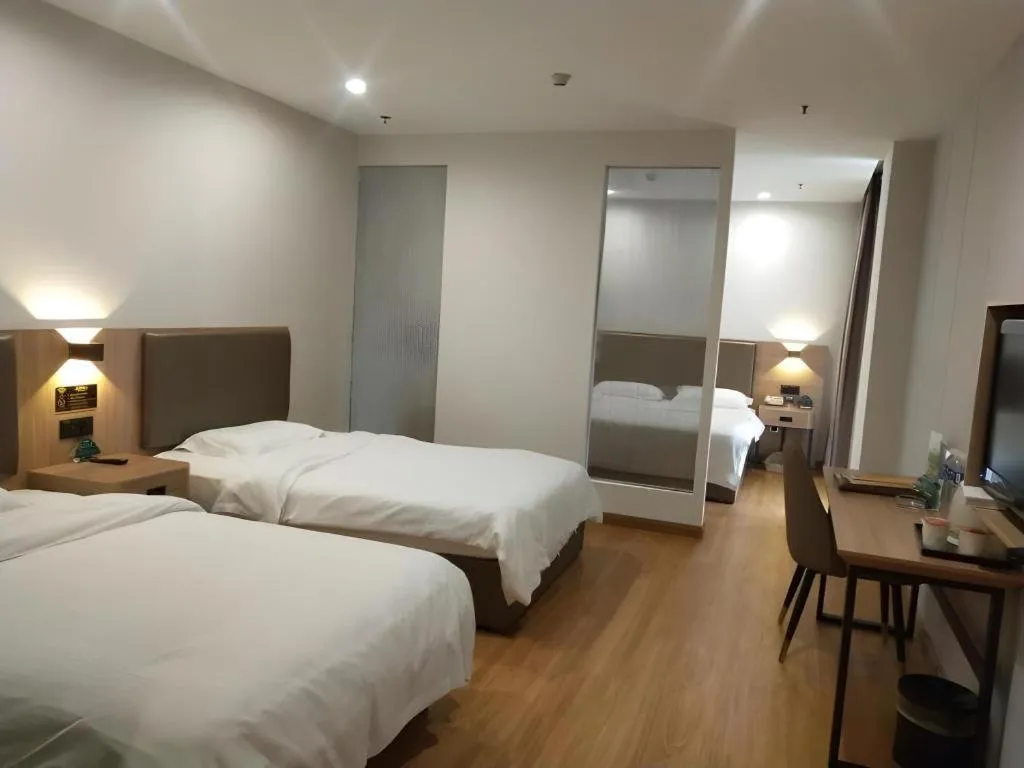 Bed in GreenTree Inn Jining Yanzhou Jiuzhou Fangyuan Business Hotel