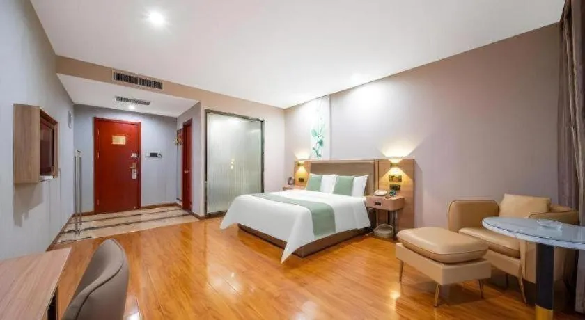 Bed in GreenTree Inn Jining Yanzhou Jiuzhou Fangyuan Business Hotel