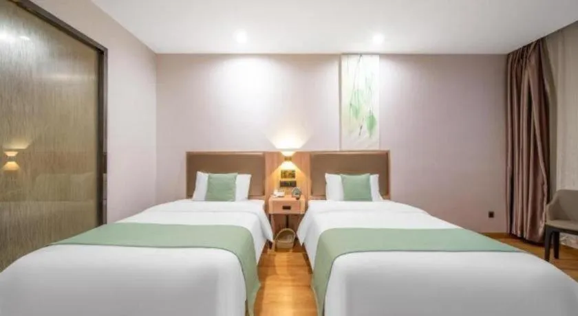 Bed in GreenTree Inn Jining Yanzhou Jiuzhou Fangyuan Business Hotel
