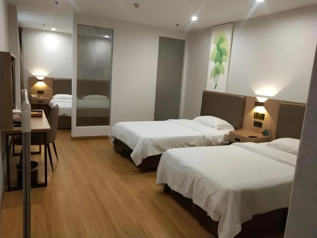 Bed in GreenTree Inn Jining Yanzhou Jiuzhou Fangyuan Business Hotel