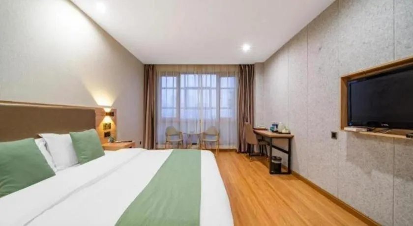 Bed in GreenTree Inn Jining Yanzhou Jiuzhou Fangyuan Business Hotel