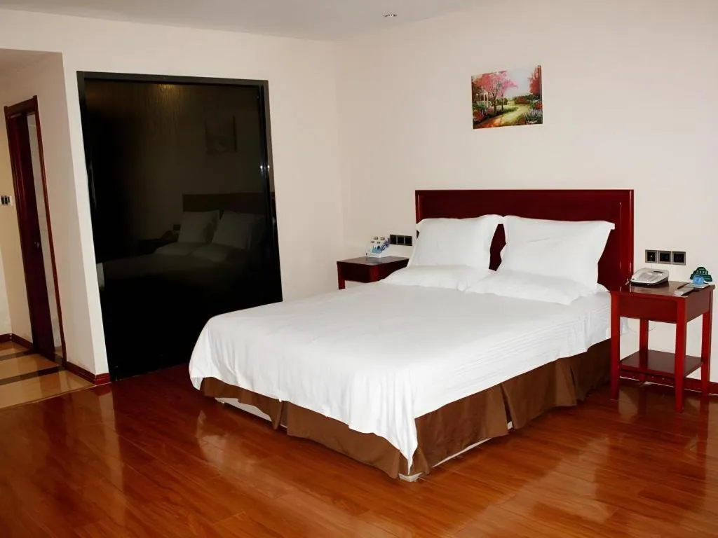 Bed in GreenTree Inn Jining Yanzhou Jiuzhou Fangyuan Business Hotel