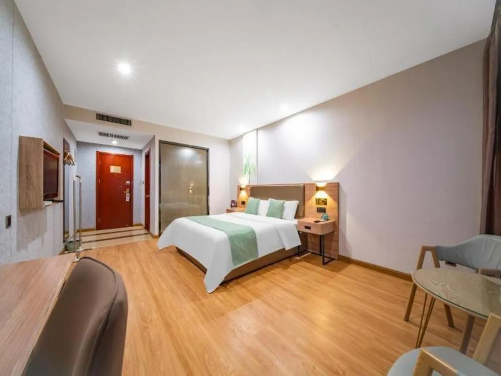 Bed in GreenTree Inn Jining Yanzhou Jiuzhou Fangyuan Business Hotel