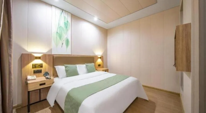 Bed in GreenTree Inn Jining Yanzhou Jiuzhou Fangyuan Business Hotel