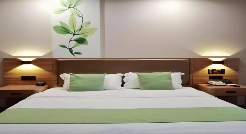 Bed in GreenTree Inn Jining Yanzhou Jiuzhou Fangyuan Business Hotel