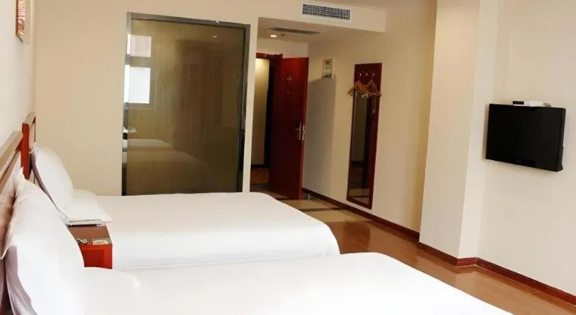 Bed in GreenTree Inn Jining Yanzhou Jiuzhou Fangyuan Business Hotel