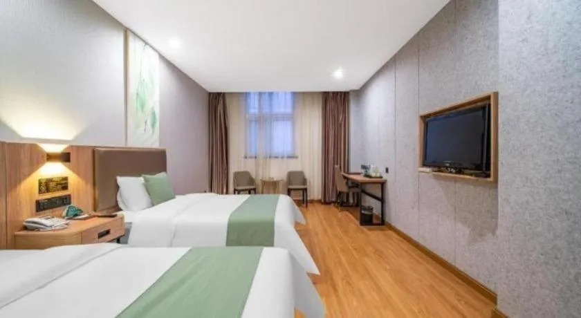 Bed in GreenTree Inn Jining Yanzhou Jiuzhou Fangyuan Business Hotel