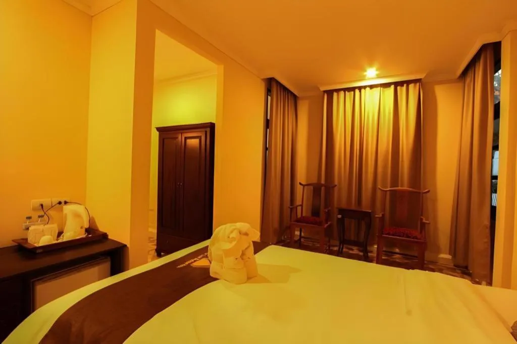 Bed in Le Luxe Boutique Hotel