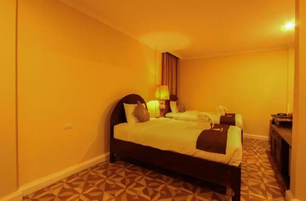 Bed in Le Luxe Boutique Hotel