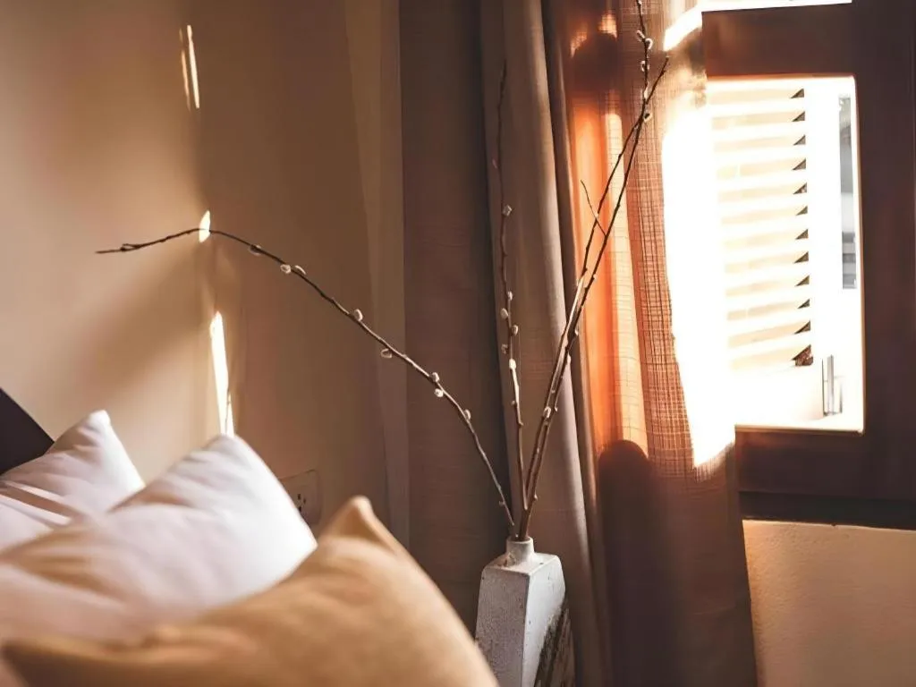 Bed in Le Luxe Boutique Hotel