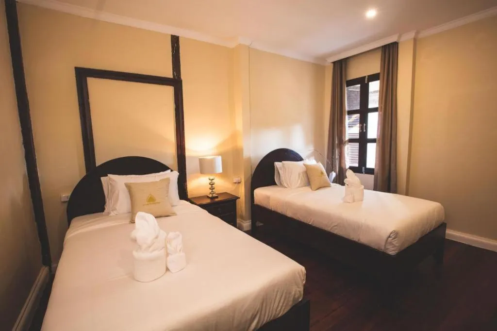 Bed in Le Luxe Boutique Hotel