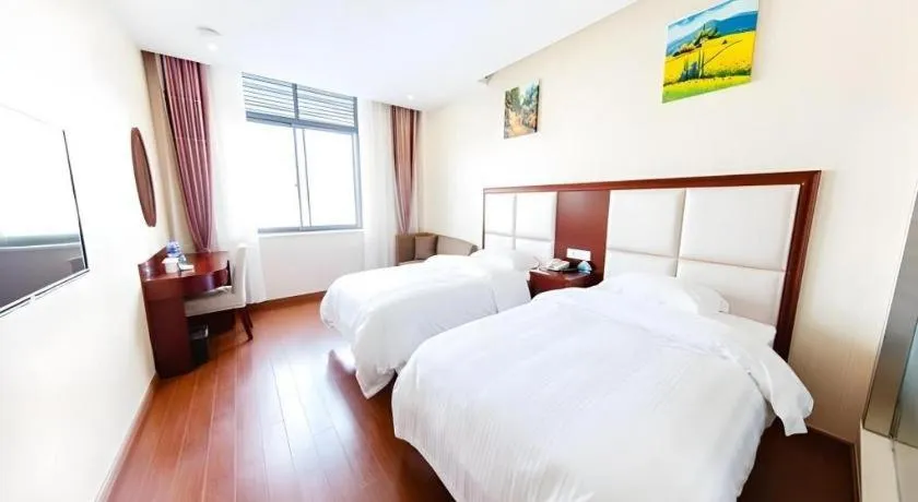Bed in GreenTree Inn Jiangsu Zhangjiagang Jingang Town Darunfa Express Hotel