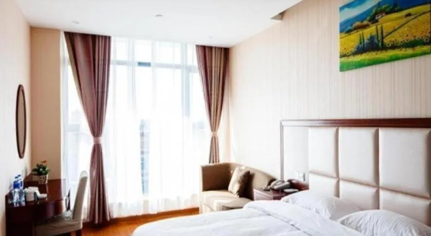 Bed in GreenTree Inn Jiangsu Zhangjiagang Jingang Town Darunfa Express Hotel