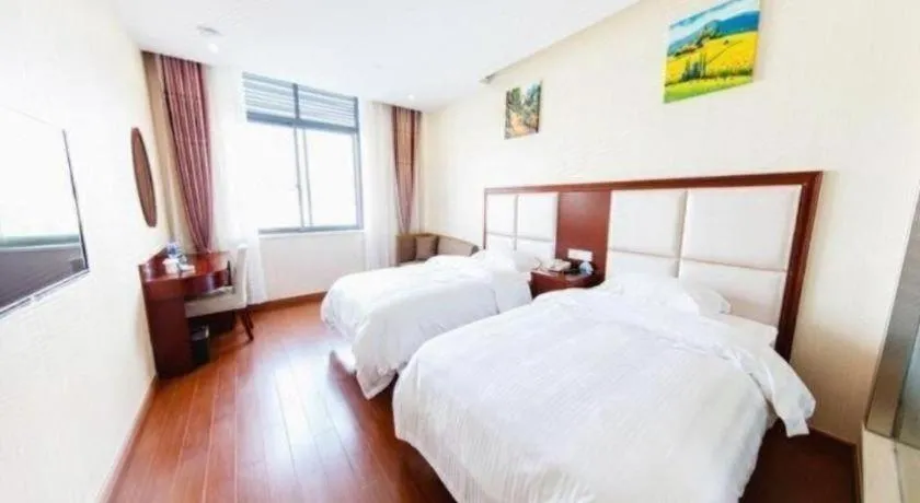 Bed in GreenTree Inn Jiangsu Zhangjiagang Jingang Town Darunfa Express Hotel