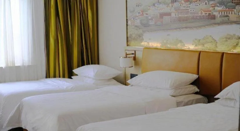 Bed in Vienna Hotel Tianjin Huaming