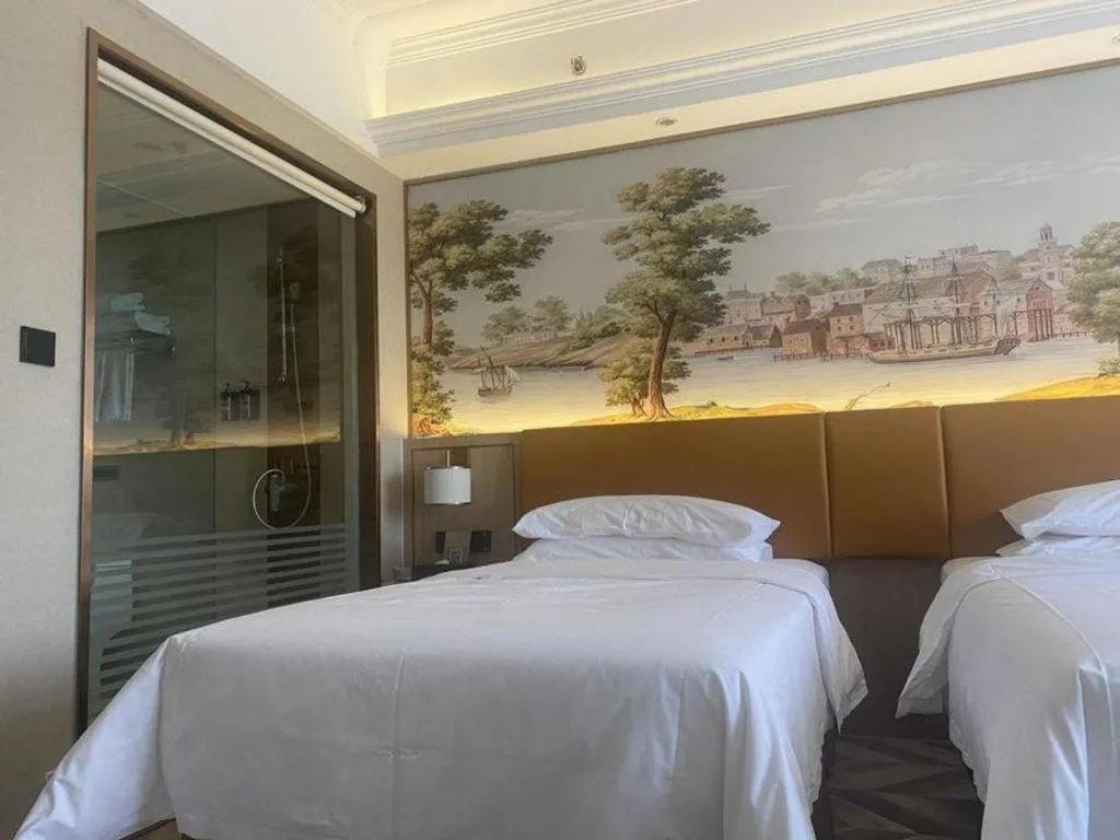 Bed in Vienna Hotel Tianjin Huaming