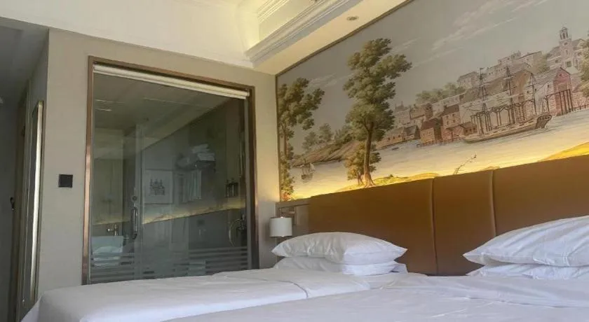 Bed in Vienna Hotel Tianjin Huaming