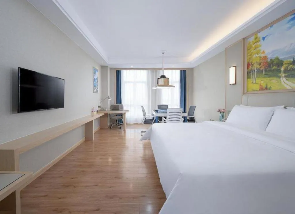 Bed in Vienna Hotel Tianjin Huaming