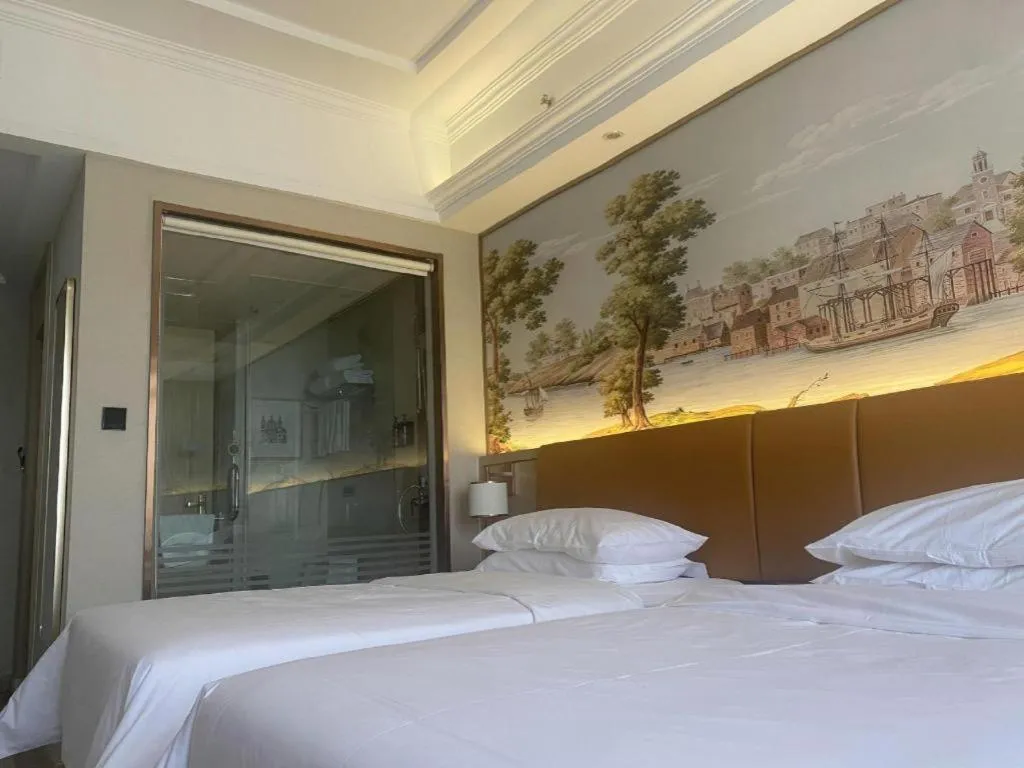 Bed in Vienna Hotel Tianjin Huaming