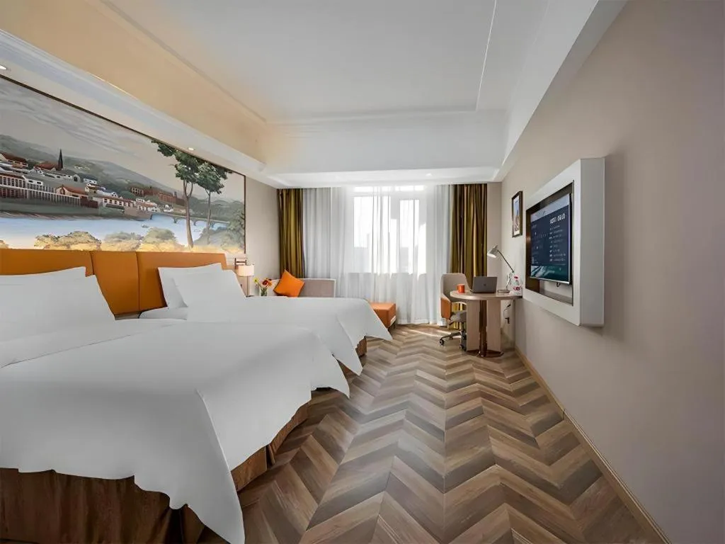 Bed in Vienna Hotel Tianjin Huaming