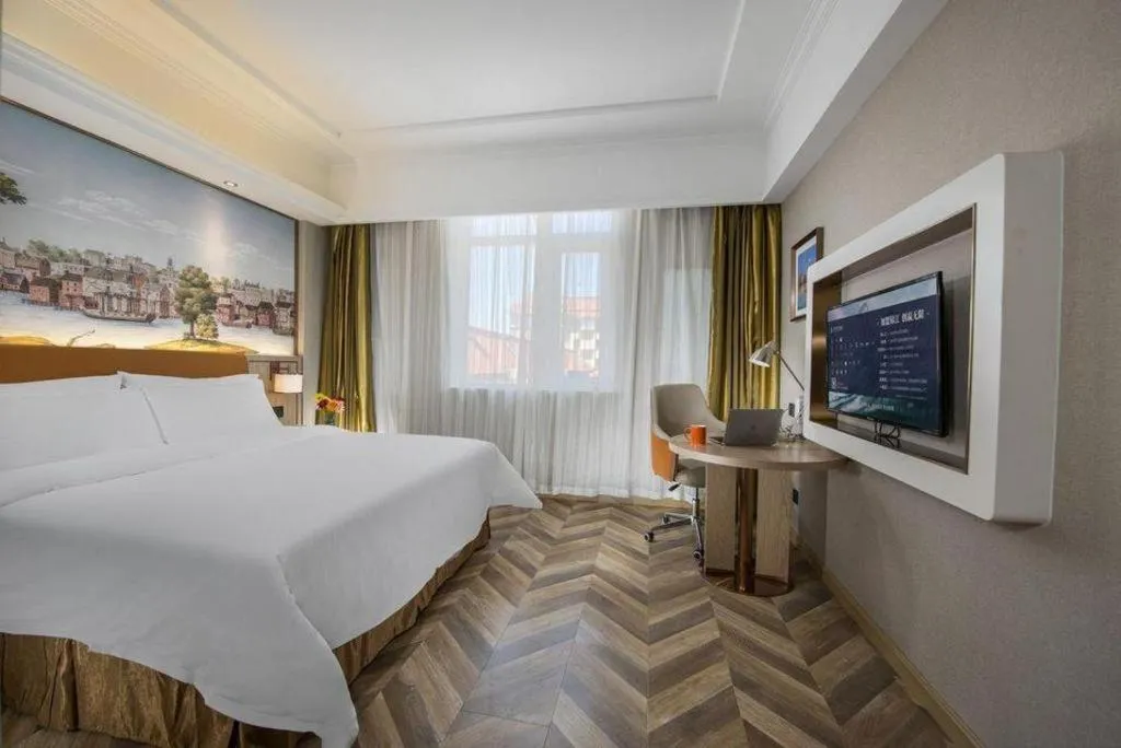 Bed in Vienna Hotel Tianjin Huaming