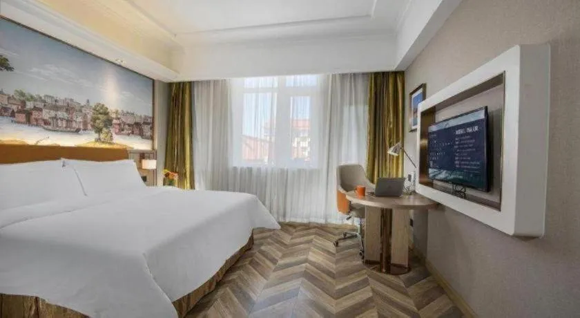 Bed in Vienna Hotel Tianjin Huaming