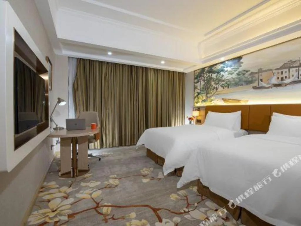 Bed in Vienna Hotel Tianjin Huaming