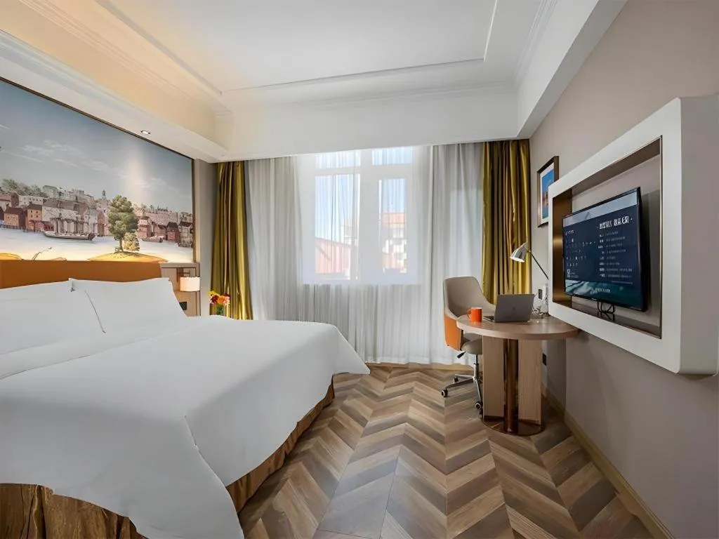 Bed in Vienna Hotel Tianjin Huaming