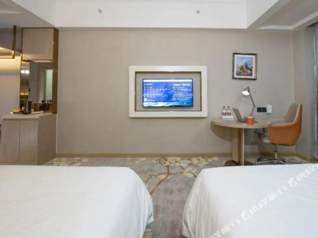 Bed in Vienna Hotel Tianjin Huaming