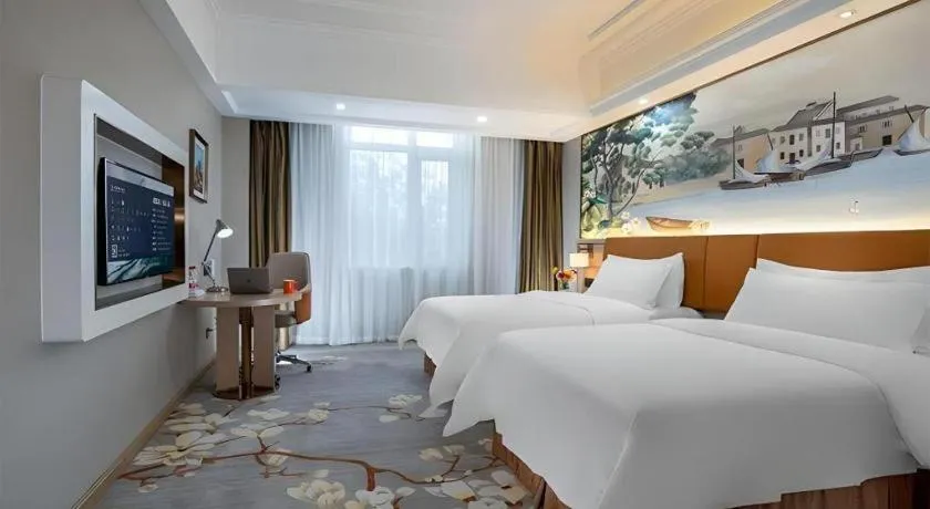 Bed in Vienna Hotel Tianjin Huaming