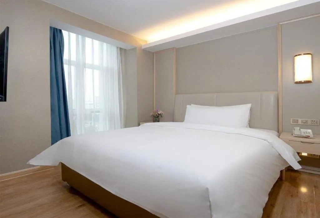 Bed in Vienna Hotel Tianjin Huaming