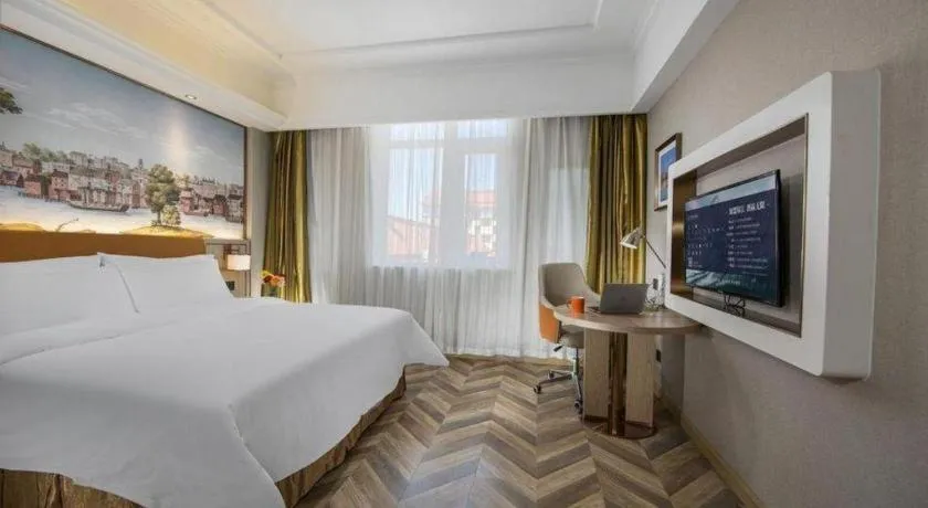 Bed in Vienna Hotel Tianjin Huaming