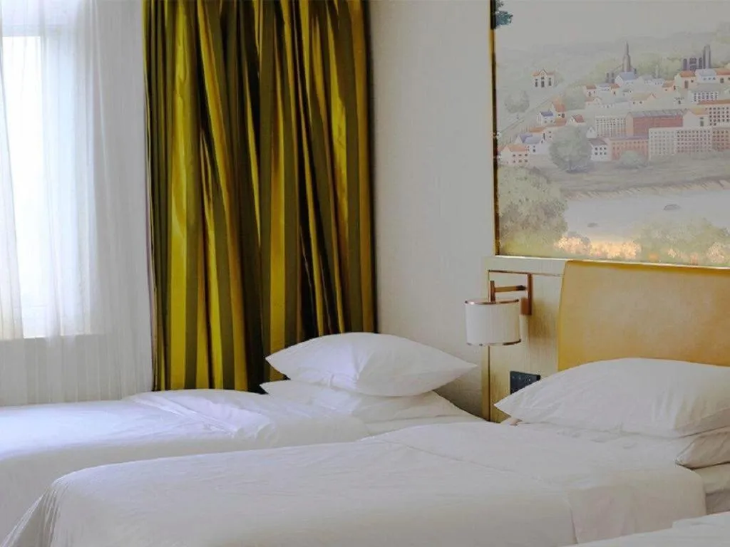 Bed in Vienna Hotel Tianjin Huaming