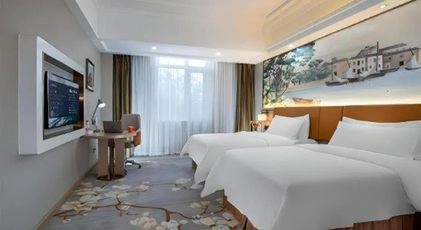 Bed in Vienna Hotel Tianjin Huaming